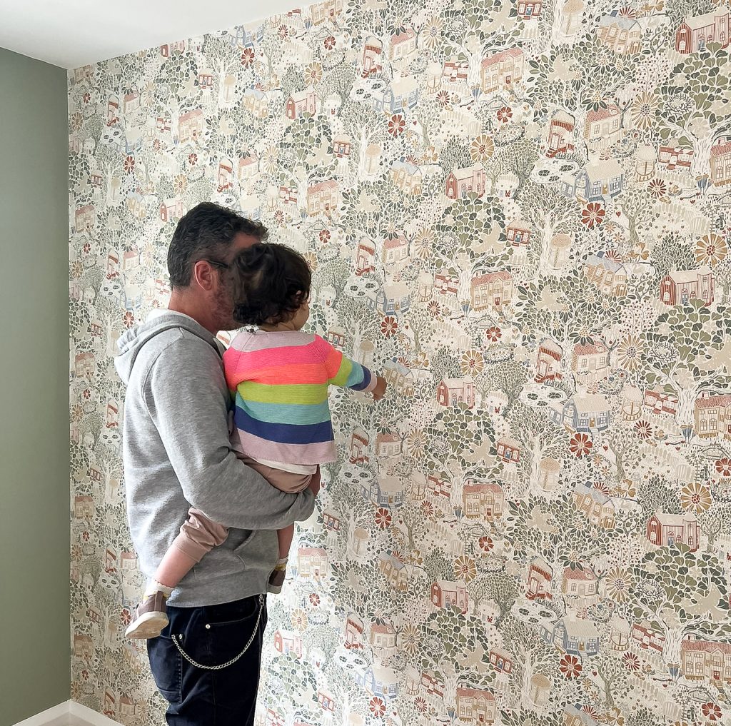Me and my two-year-old daughter checking out the new wallpaper in her nursery